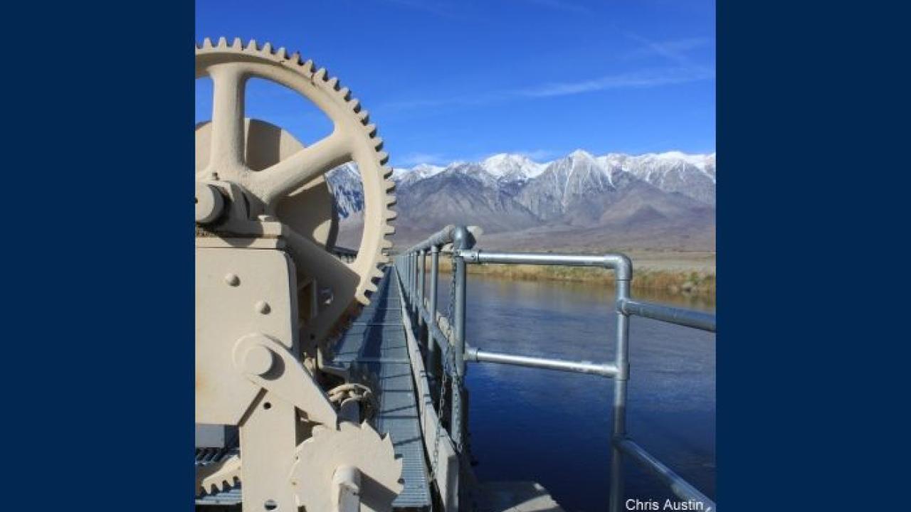 View of machinery by a lake