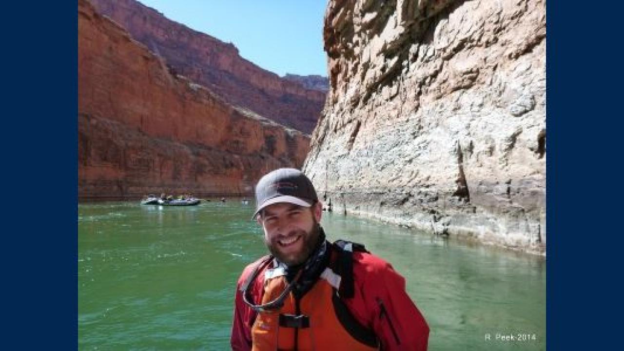 Image of Ryan Peek in front of river
