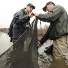 Carson Jeffres and Eric Holmes stand in a floodplain. 